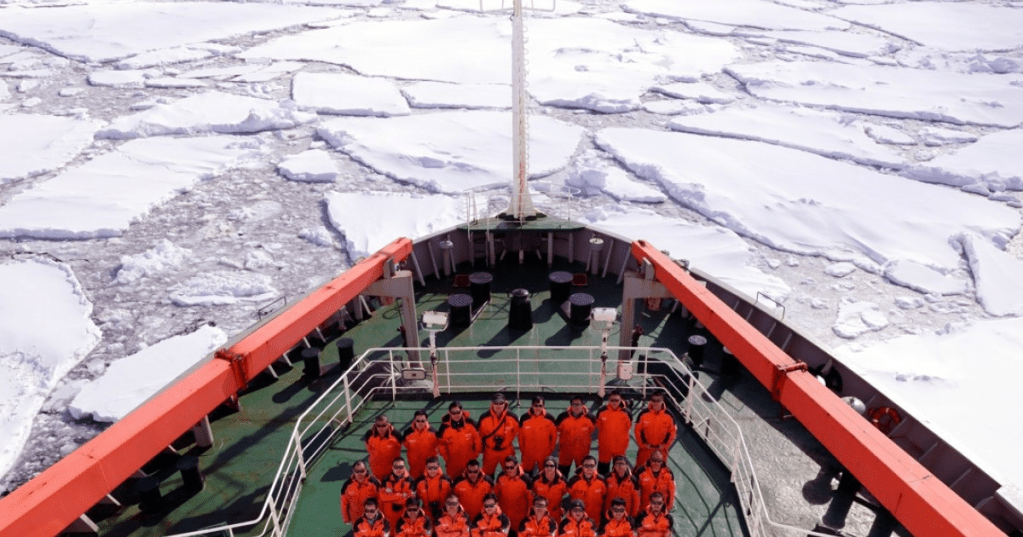 members-of-chinas-34th-antarctic-expedition-pose-on-the-deck-of-chinas-research