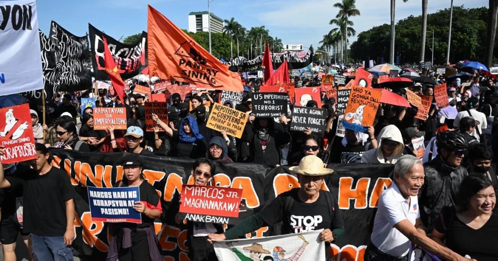 Protesters take part in a rally during a demonstration in Manila on Sept. 21.Photographer: Ted Aljibe/AFP/Getty Images