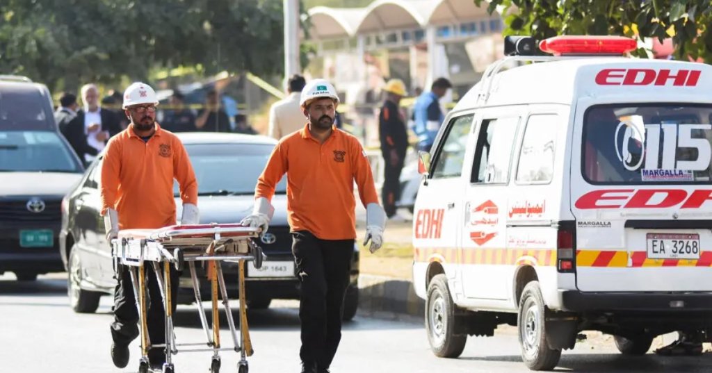 Rescue workers outside the court building in Islamabad on Tuesday.Credit...Waseem Khan/Reuters