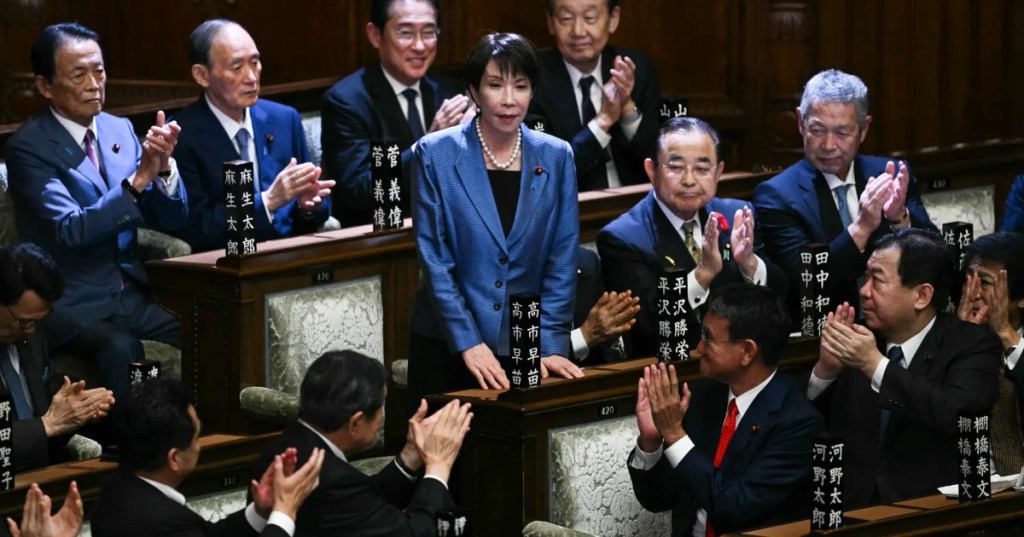 Ms. Takaichi acknowledging the applause after she was elected as Japan’s new prime minister during an extraordinary session of Parliament in Tokyo on Tuesday (Oct. 21). Credit... Philip Fong-Agence France-Presse — Getty Images