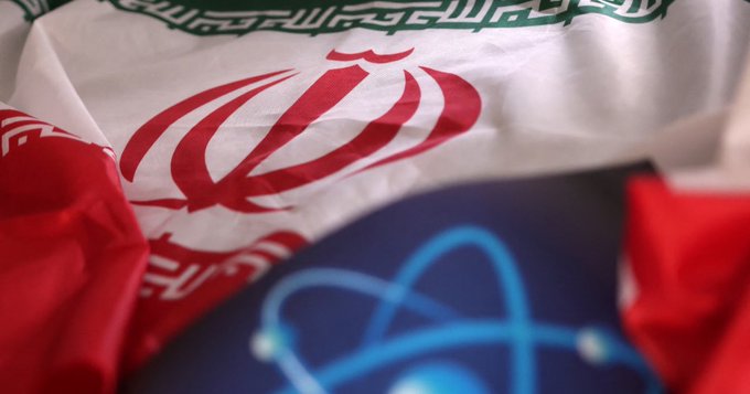 Atomic symbol and Iranian flag are seen in this illustration. REUTERS/Dado Ruvic/Illustration