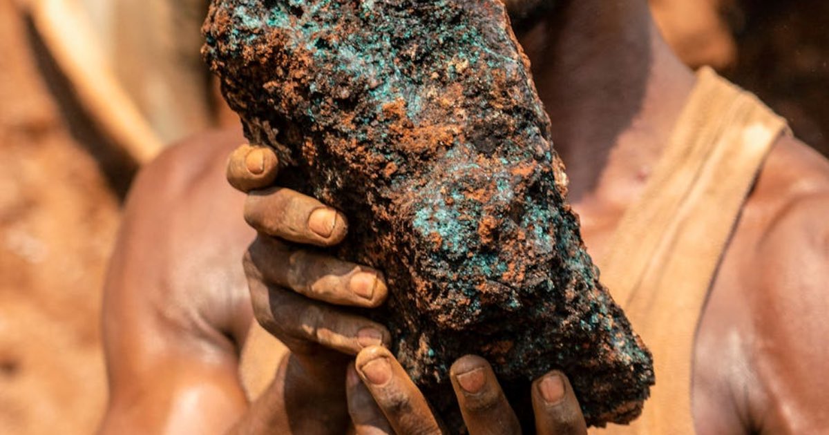 Artisanal miner holds a cobalt stone at the Shabara artisanal mine near Kolwezi. Junior Kannah/AFP via Getty Images