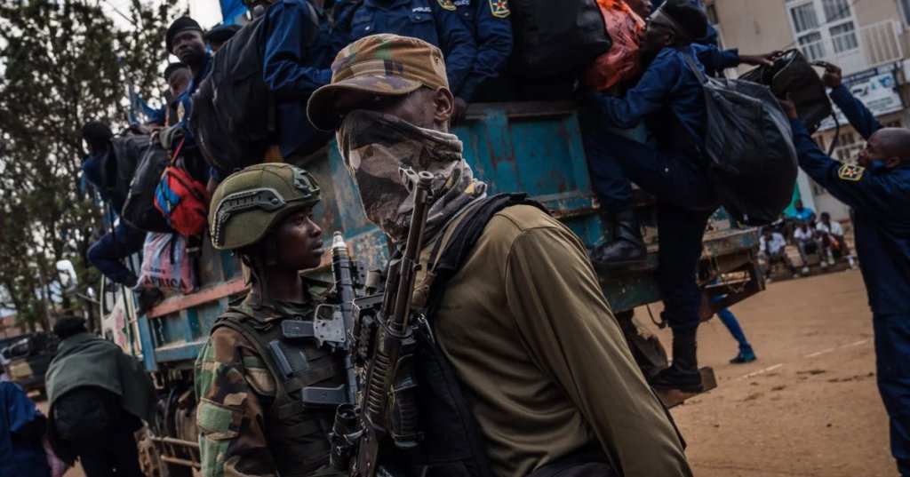 M23 rebels guard a unit of surrendering Congolese police officers in Bukavu, DRC. Photograph: Hugh Kinsella Cunningham/Getty Images