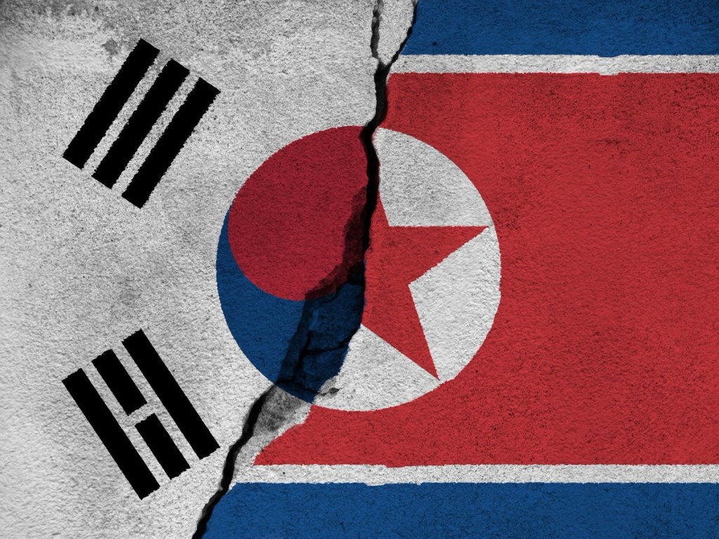 North Korea and South Korea flag on cracked background. (File Photo)