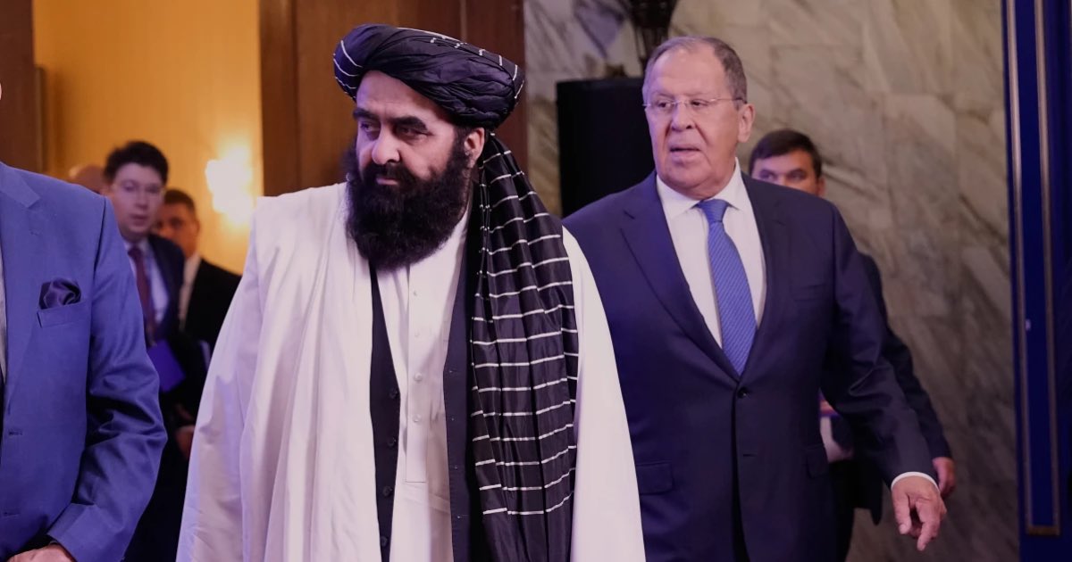 Afghanistan's Foreign Minister Amir Khan Muttaqi, left, and Russian Foreign Minister Sergey Lavrov arrive to pose for a photo prior to their talks on the sidelines of the Moscow format consultations on Afghanistan in Moscow, Russia, Tuesday, Oct. 7, 2025. (AP Photo/Alexander Zemlianichenko)