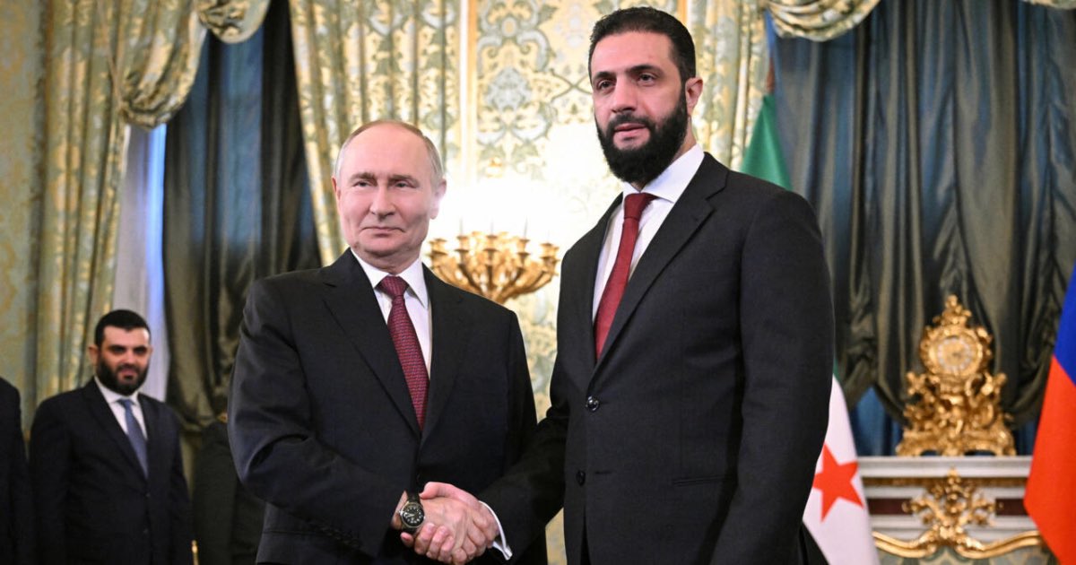Russia's President Vladimir Putin shakes hands with Syria's Ahmed al-Sharaa in Moscow on October 15, 2025. © Sergey Bobylyov, Sputnik via Reuters