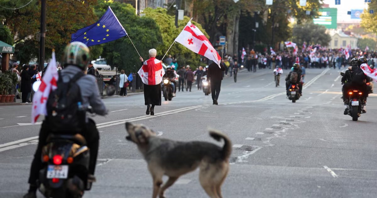 Opposition supporters attend a rally on the day of local elections in Tbilisi, Georgia October 4, 2025. REUTERS/Irakli Gedenidze