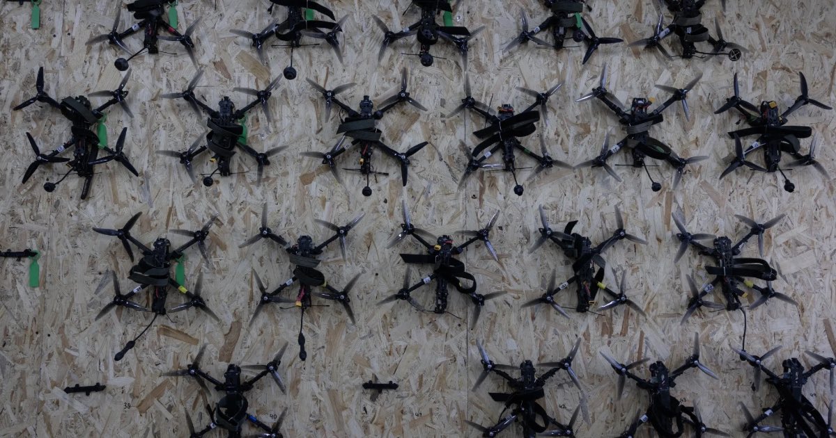 Drones hang on the wall during a class for students to learn to assemble and fly drones in Kyiv region on Sept. 3. Photographer: Paula Bronstein/Getty Images