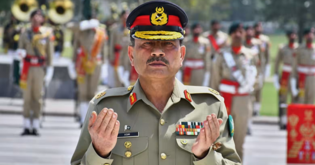Field Marshal Gen. Asim Munir prays after laying a wreath on the Martyrs' Monument during a ceremony at General Headquarters, in Rawalpindi, Pakistan, on May 21. (Inter Services Public Relations via AP)