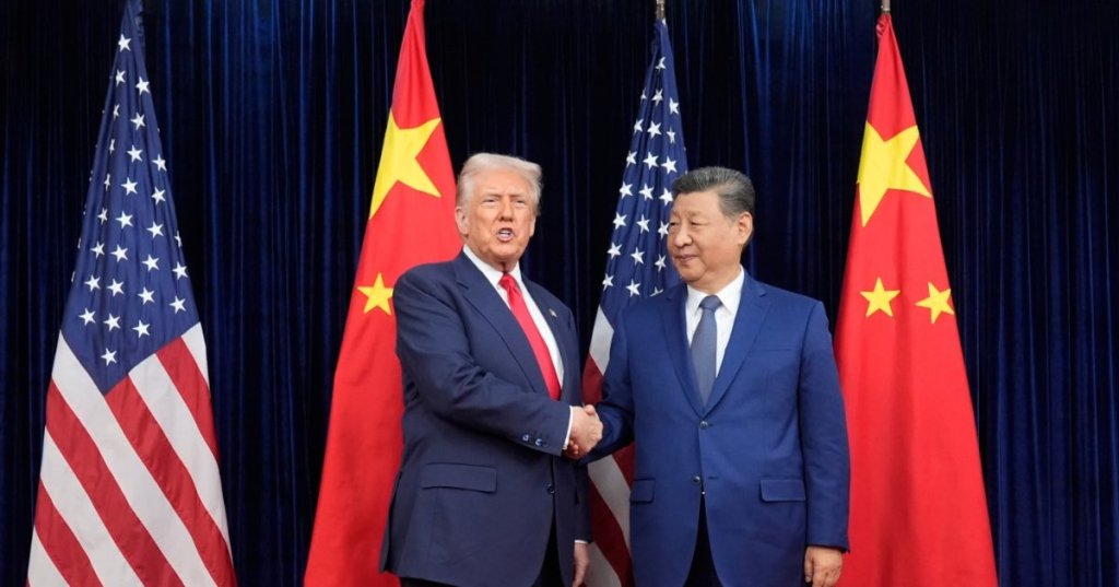 President Donald Trump, left, and Chinese President Xi Jinping shake hands before their meeting at Gimhae International Airport in Busan, South Korea, Thursday, Oct. 30, 2025. (AP Photo/Mark Schiefelbein)
