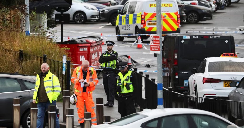 Police officers and emergency personnel work at the scene following a stabbing incident at a train station in Huntingdon, Britain, November 2, 2025. REUTERS/Jack Taylor