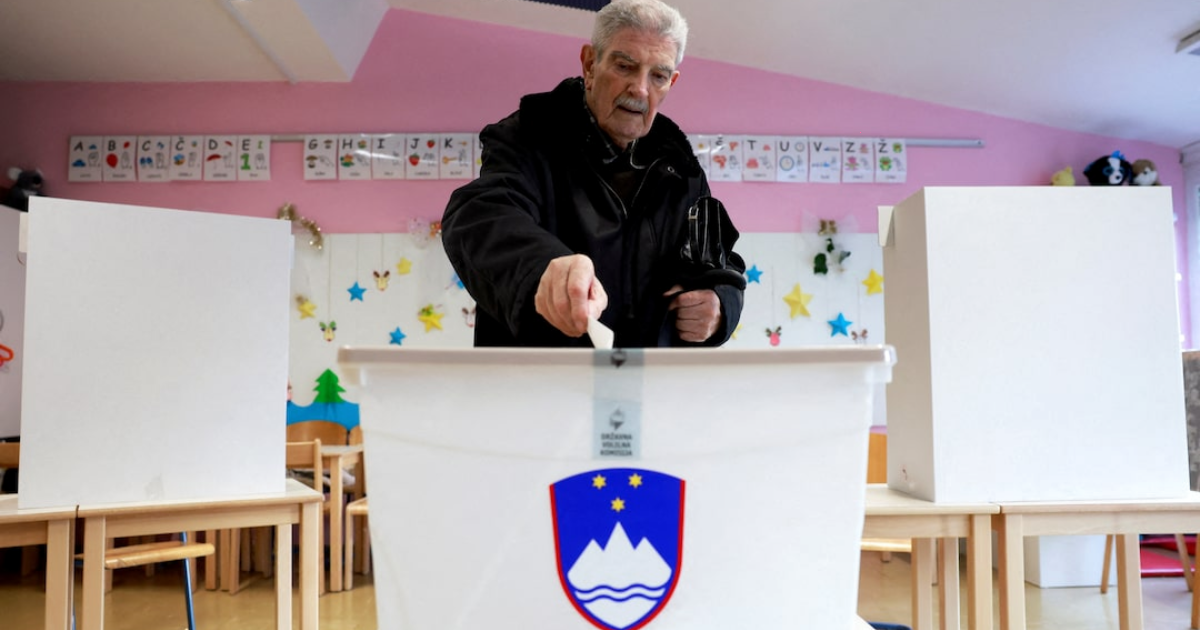 A person casts their ballot at a polling station during a referendum vote on a law that proposes legalizing assisted dying for some terminally ill adults, in Ljubljana, Slovenia, November 23, 2025. Borut Zivulovic/REUTERS