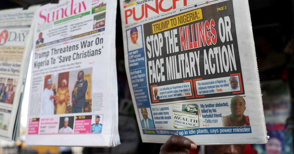 LA newspaper vendor pulls a newspaper with an article reporting U.S. President Donald Trump's message to Nigeria over the treatment of Christians, at a newspaper stand in Ojuelegba, Lagos, Nigeria, November 2, 2025. REUTERS/Sodiq Adelakun