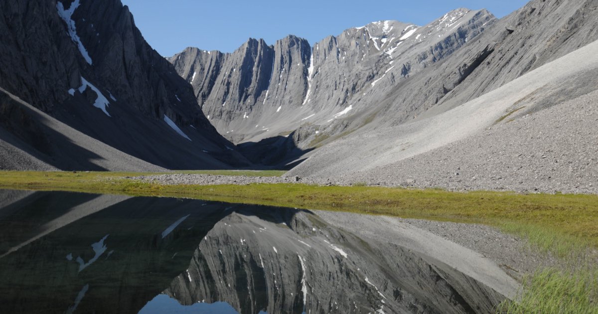 In this July 30, 2014 photo provided by the National Park Service is a small tarn in a hidden valley in the Itkillik Preserve at the Arctic National Park and Preserve in Alaska. The nation’s northernmost national park says its new management plan will have to consider the effects of a new industrial road to the mining district of Ambler, the first road that would be constructed within its Maryland-sized boundaries. (AP Photo/National Park Service, Cadence Cook)