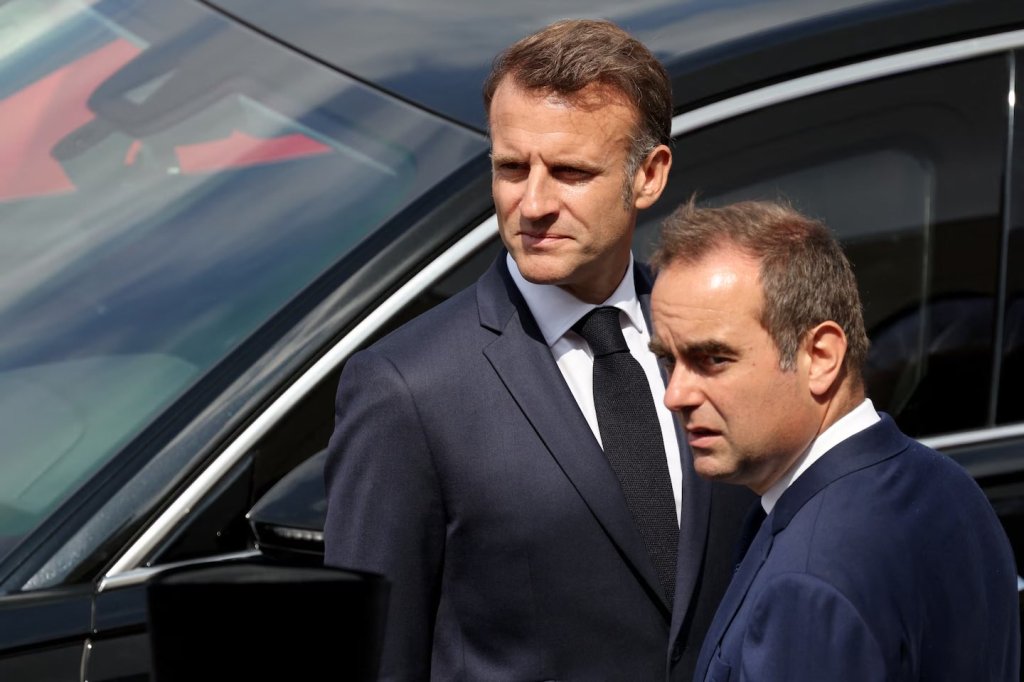 French President Emmanuel Macron, left, and then-Minister of the Armed Forces Sébastien Lecornu in Paris on July 14. (Ludovic Marin/AFP/Getty Images)