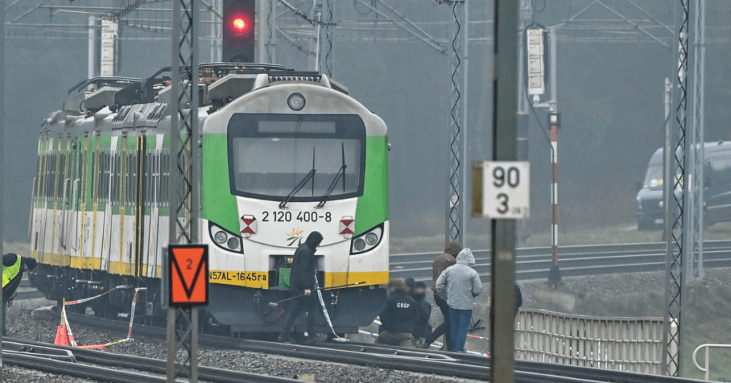 Soldiers and police investigate a destroyed section of railway near Mika railway station, central Poland.Photograph: Przemysław Piątkowski/EPA