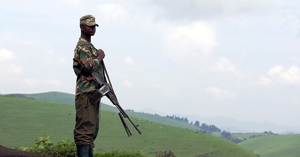 An M23 soldier on patrol [Teddy Mazina/Al Jazeera]