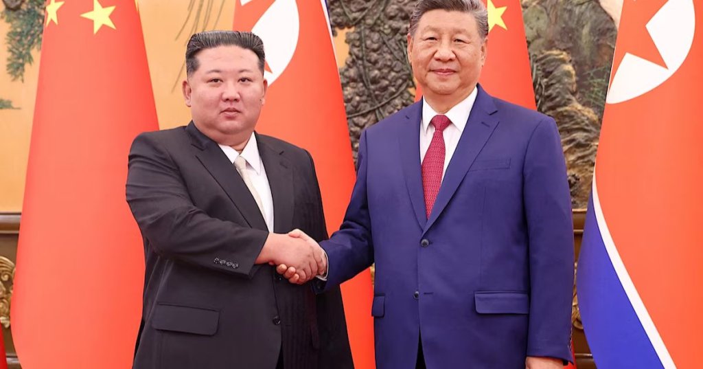 Chinese President Xi Jinping and Democratic People's Republic of Korea (DPRK) leader Kim Jong Un shake hands at the Great Hall of the People in Beijing, China September 4, 2025. China Daily via REUTERS