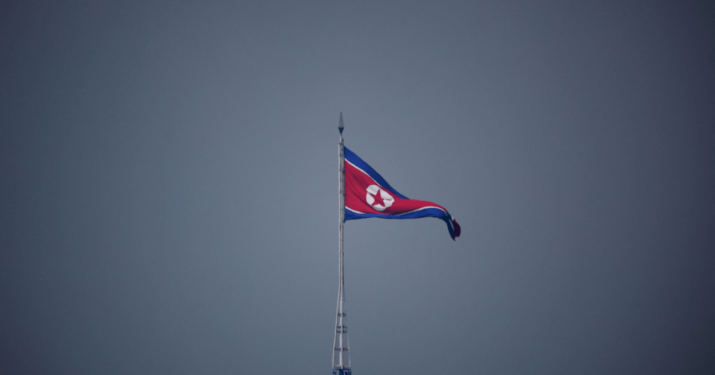 FILE PHOTO: A North Korean flag flutters near the truce village of Panmunjom inside the demilitarised zone separating the two Koreas.