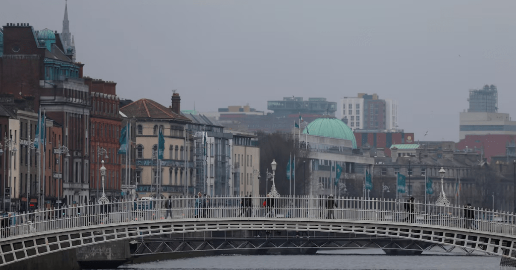 People walk on the Ha’penny Bridge, in Dublin, Ireland, February 18, 2025. REUTERS/Clodagh Kilcoyne