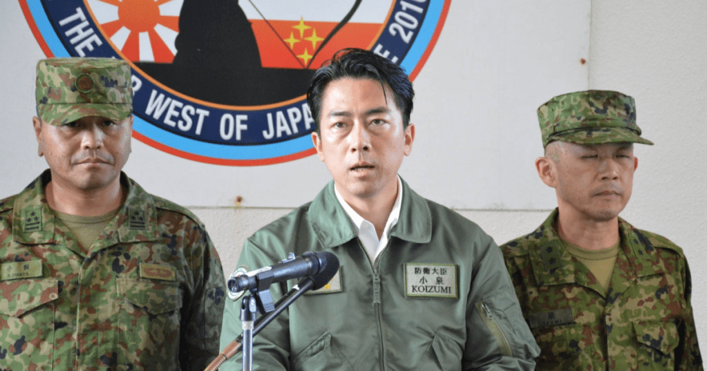 Defense Minister Shinjiro Koizumi speaks to reporters after inspecting the Ground Self-Defense Force garrison on Yonaguni Island, Okinawa Prefecture, on Sunday. | JIJI