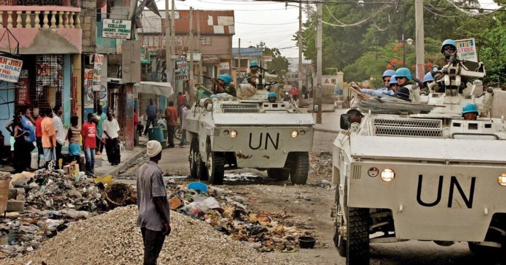 MINUSTAH/Sophia Paris | UN peacekeepers conduct a patrol in the volatile neighbourhood of Bel Air in the Haitian capital, Port-au-Prince in April 2004.