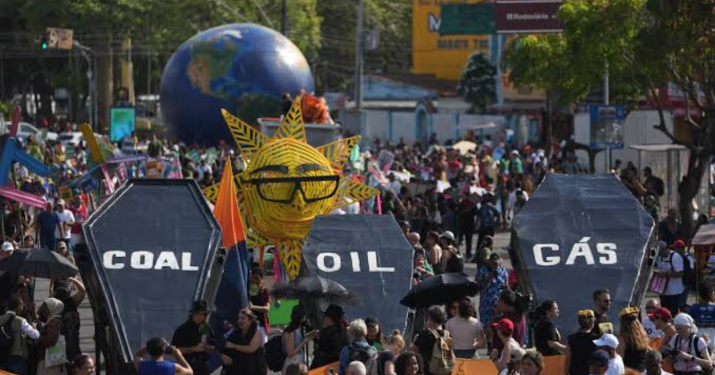Climate activist protest with coffins that read coal, oil and gas during the COP30 U.N. Climate Summit, Saturday, Nov. 15, 2025, in Belem, Brazil. (AP Photo.Andre Penner)