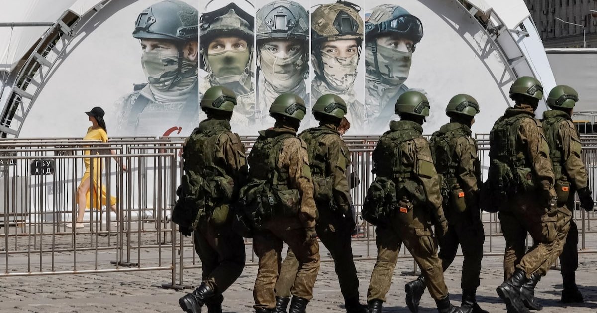 Russian servicemen walk at an exhibition displaying armoured vehicles and equipment captured by the Russian army from Ukrainian forces in the course of Russia-Ukraine conflict, at Victory Park open-air museum on Poklonnaya Gora in Moscow, Russia May 31, 2024. REUTERS/Shamil Zhumatov