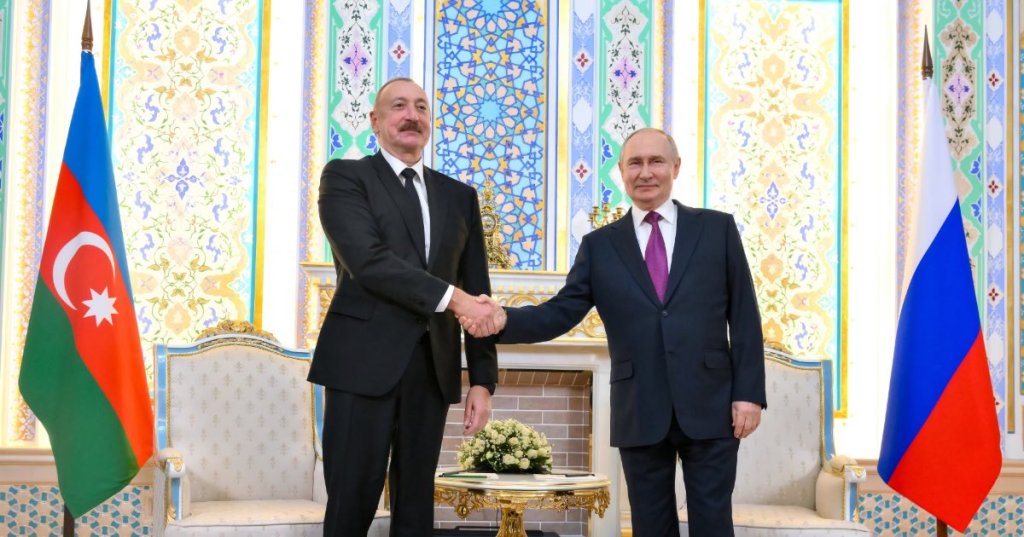 Russian President Vladimir Putin, right, and Azerbaijan's President Ilham Aliyev talk during their meeting on the sidelines of the Russia-Central Asia summit in Dushanbe, Tajikistan, on Thursday, Oct. 9, 2025. (Grigory Sysoyev, Sputnik, Kremlin Pool Photo via AP)