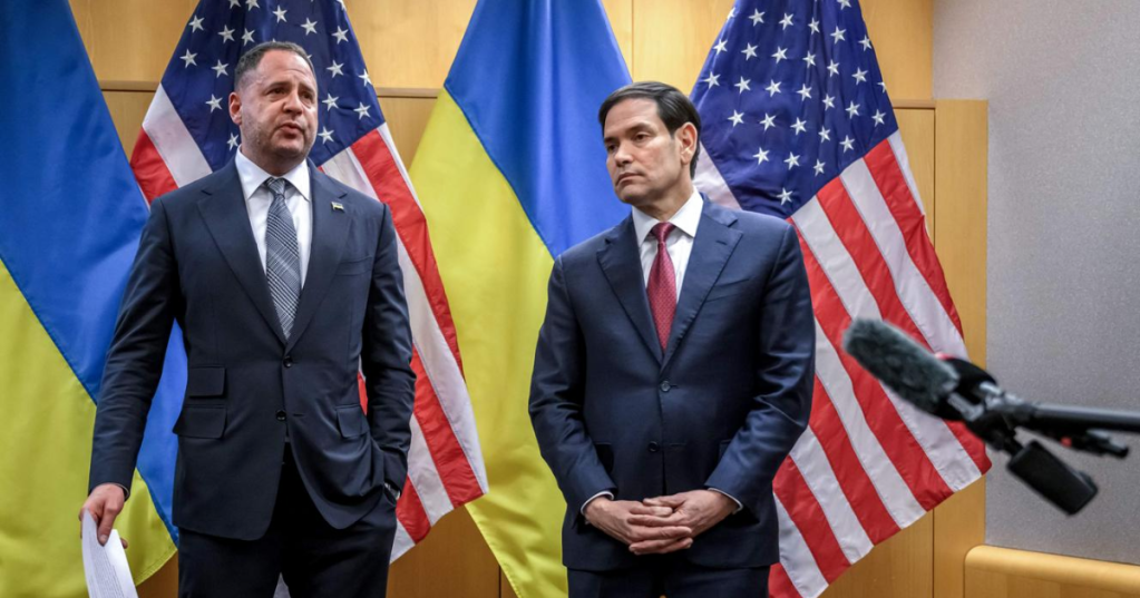 US Secretary of State Marco Rubio (R) and Ukraine's Presidential Office Chief of staff Andriy Yermak hold a press conference following their closed-door talks on a US plan to end the war in Ukraine at the US Mission in Geneva, on November 23, 2025. FABRICE COFFRINI / AFP