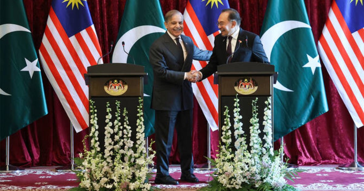 Pakistan's Prime Minister Shehbaz Sharif, left, and Malaysia's Prime Minister Anwar Ibrahim shake hands as they hold a news conference during Sharif's visit in Putrajaya, Malaysia, on October 6, 2025. (AP)