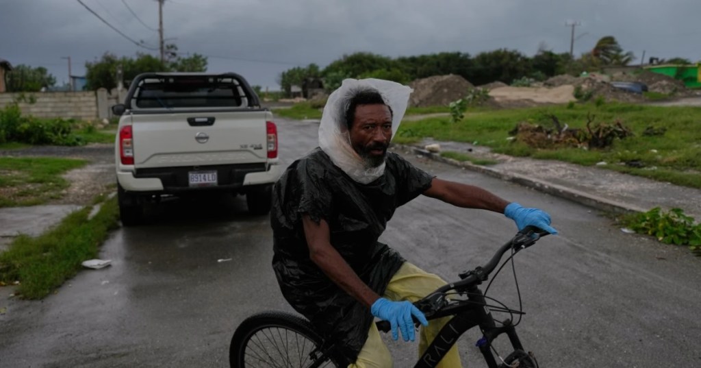 A man rides a bicycle ahead of the forecast arrival of Hurricane Melissa in Kingston, Jamaica, Sunday, Oct. 26, 2025. (APPhoto..Matias Delacroix)