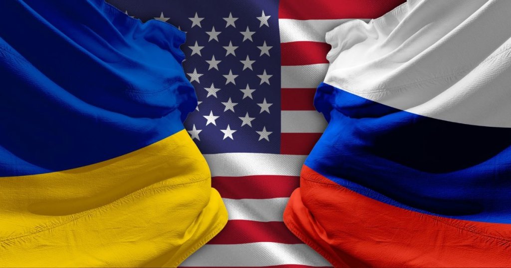 National flags of Ukraine, the United States, and Russia juxtaposed. (Shutterstock)