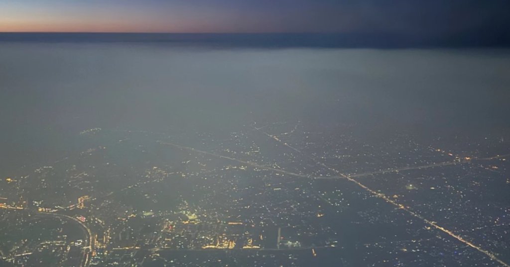 A layer of smog hangs over the skyline as seen from an aircraft window in New Delhi, India, Saturday, Oct. 25, 2025. (AP Photo.Yirmiyan Arthur)