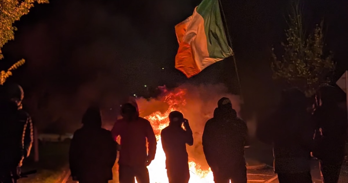 Protesters in Saggart, as disturbances have flared outside Citywest Hotel which used to house asylum seekers. Picture date: Tuesday October 21, 2025. (PA Wire)