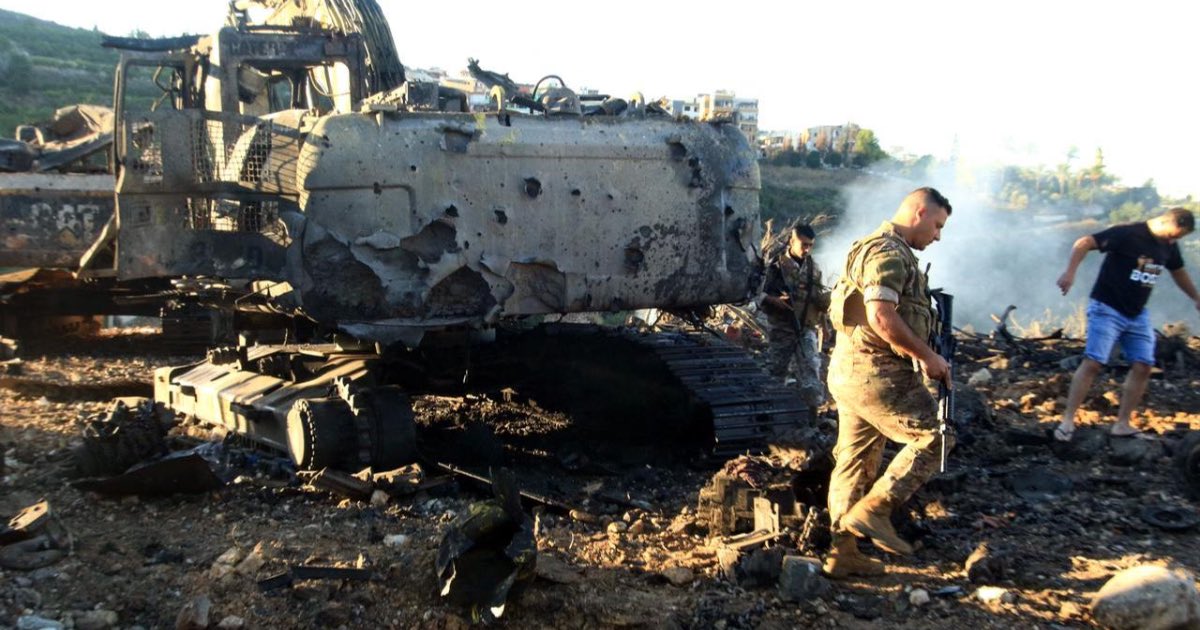 Lebanese soldiers walk next to a destroyed digger following an overnight Israeli strike in Al-Msayleh area in southern Lebanon on October 11, 2025. (AFP Photo)