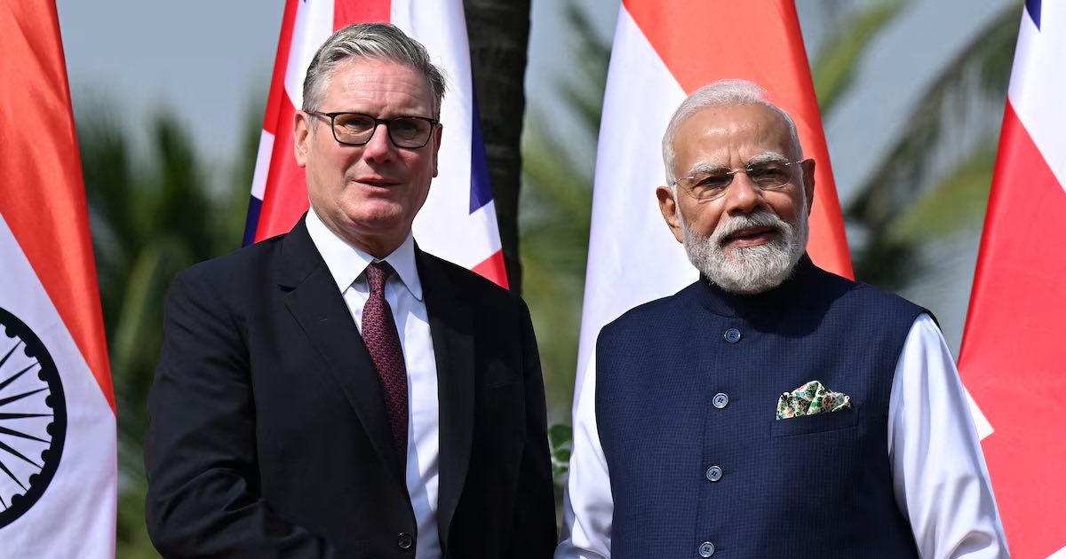 British Prime Minister Keir Starmer is greeted by Prime Minister of India Narendra Modi, on his arrival at Raj Bhavan on October 9, 2025 in Mumbai, India. Leon Neal/Pool via REUTERS
