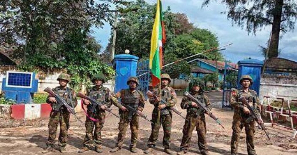 In this image released on Oct. 1, 2025 by the Myanmar Military, soldiers pose for a photo in front of the captured police station in Kyaukme, a town that the resistance forces had controlled for more than a year, in the northern part of Shan state. (Myanmar Military via AP)