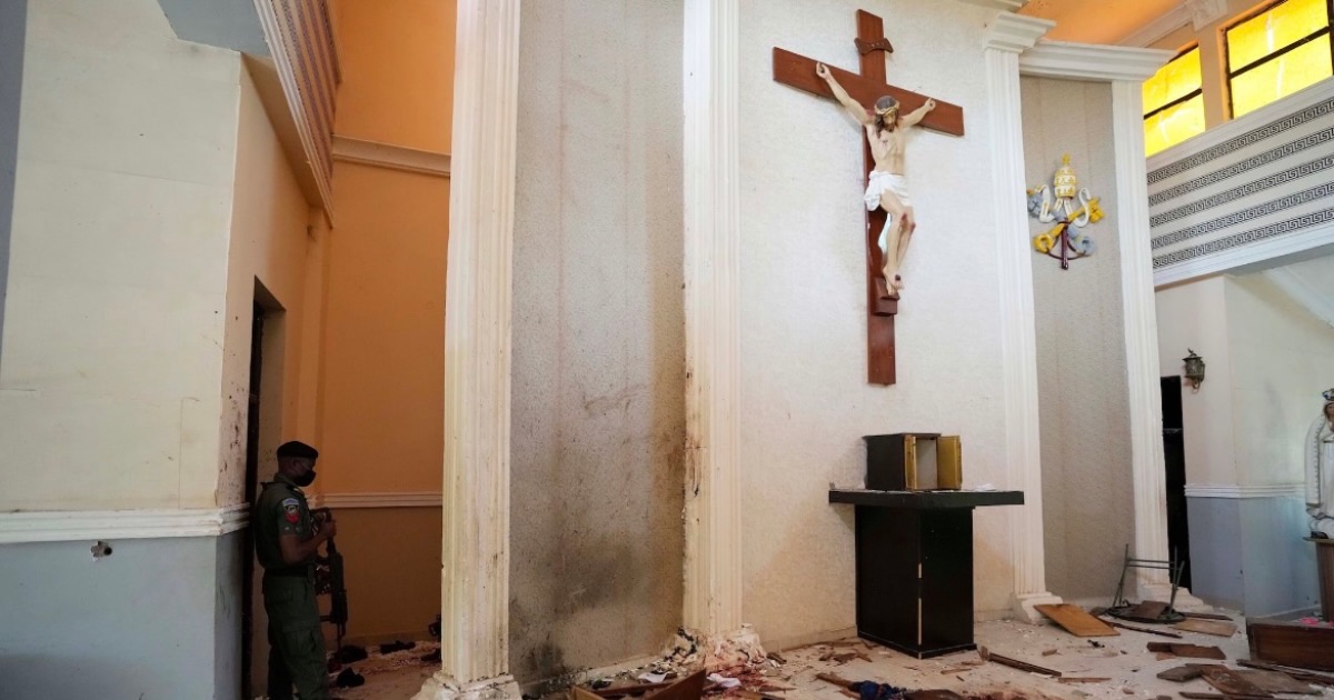A police officer stands guard inside the St. Francis Catholic Church, a day after an attacked that targeted worshipers in Owo, Nigeria, June. 6, 2022. (AP Photo/Sunday Alamba, File)