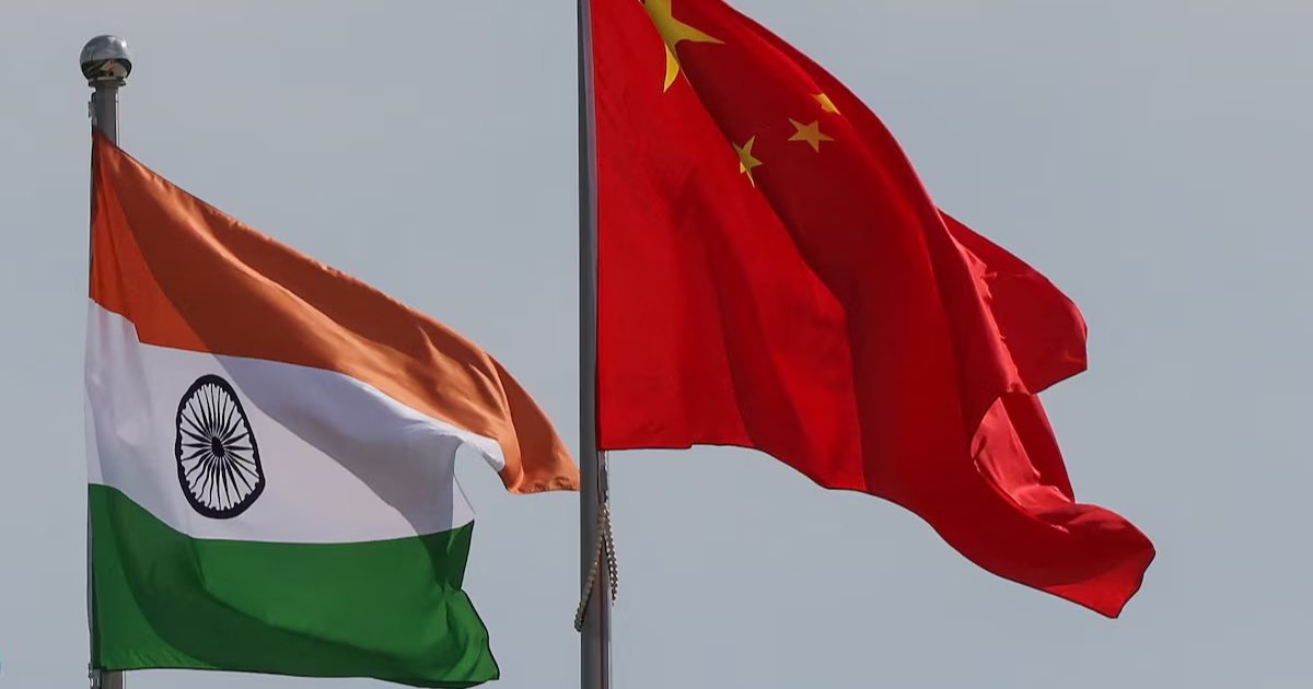 National flags of China and India fly next to the Meijiang Convention and Exhibition Center, a venue for 2025 Shanghai Cooperation Organisation (SCO) summit in Tianjin, China August 30, 2025. REUTERS/Maxim Shemetov