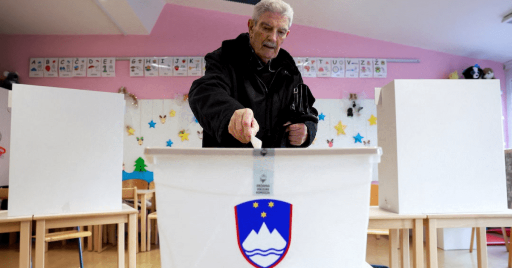A person casts their ballot at a polling station during a referendum vote on a law that proposes legalizing assisted dying for some terminally ill adults, in Ljubljana, Slovenia, November 23, 2025. Borut Zivulovic/REUTERS