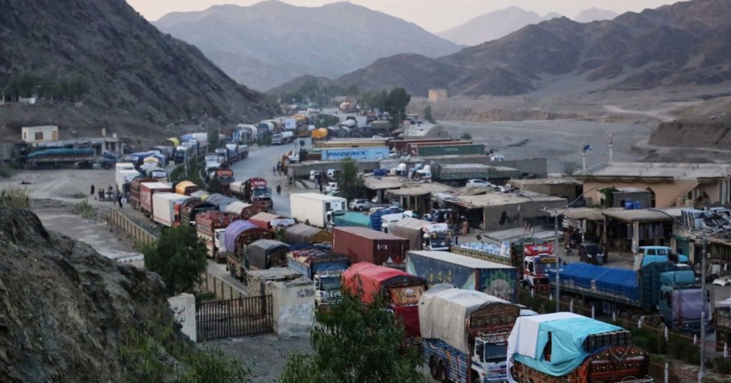 A line of cargo trucks bound for Pakistan is stranded on the Afghan side of the Torkham border crossing, which remained closed after clashes, in Nangarhar province, Afghanistan on Oct 14(AP)