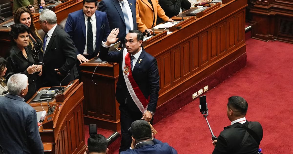 Peru's new president Jose Jeri waves on the day of the swearing-in ceremony, after Congress voted to remove former President Dina Boluarte, in Lima, October