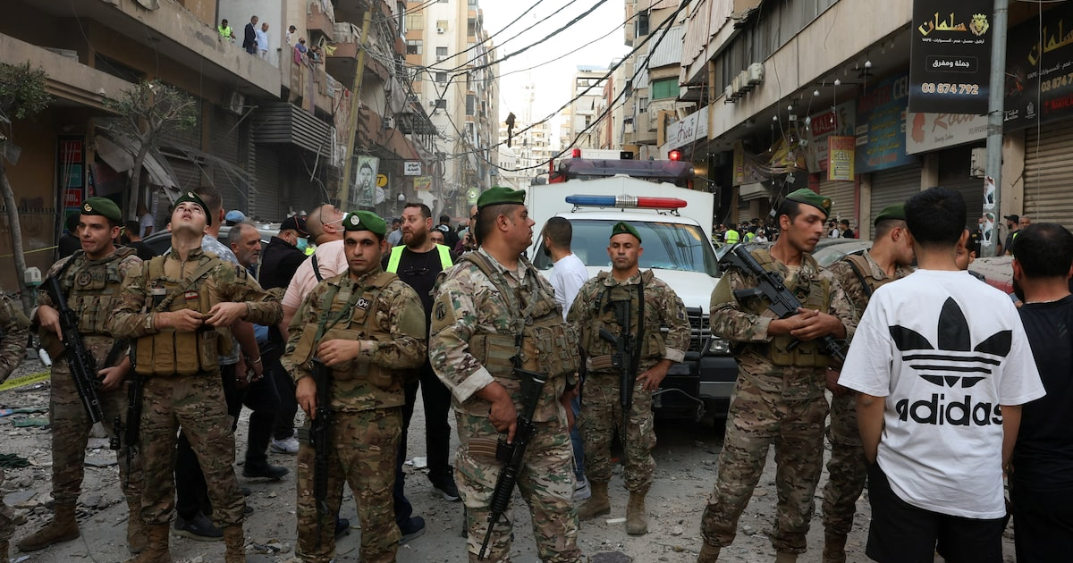 Members of the Lebanese army secure the area near the site of an Israeli strike, after Israeli military said on Sunday that it struck a militant from the Lebanese Iran-aligned Hezbollah group, in Beirut's southern suburbs, Lebanon November 23, 2025. REUTERS/Mohamed Azakir
