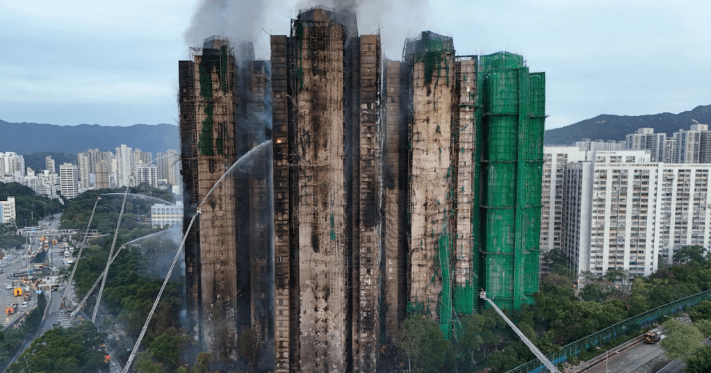 A drone view shows flames and thick smoke rising from the Wang Fuk Court housing estate during a major fire, in Tai Po, Hong Kong, China. REUTERS/Tyrone Siu