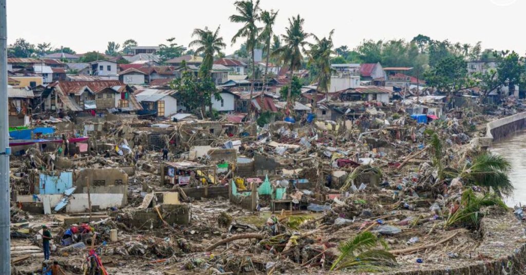 In this photo provided by the Malacanang Presidential Communications Office, damaged homes are shown beside Mananga Bridge in Talisay, Cebu Province, central Philippines on Friday Nov. 7, 2025 after Typhoon Kalmaegi devastated the province and claimed lives.Malacanang Presidential Communications Office/AP