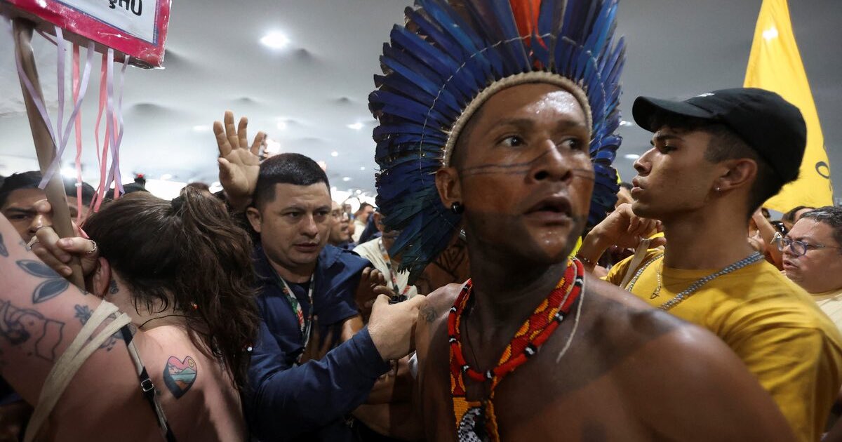 An Indigenous demonstrator looks on as protesters force their way into the venue hosting the UN Climate Change Conference
(COP30), in Belem, Brazil, November 11, 2025. REUTERS/Anderson Coelho