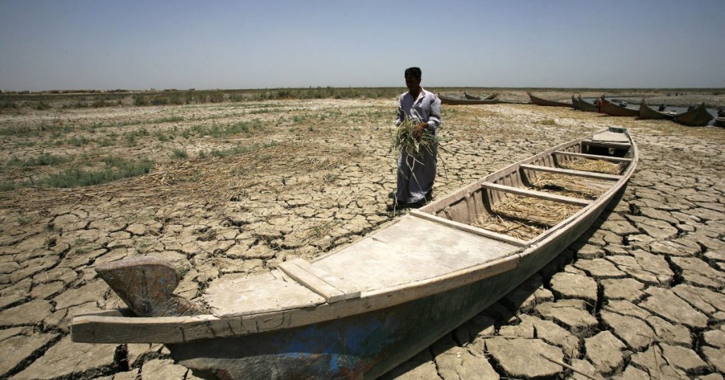 Dry marsh of Chibayish, near the city of NasiriyaH, in southern Iraq. [Haidar Hamdani/AFP]