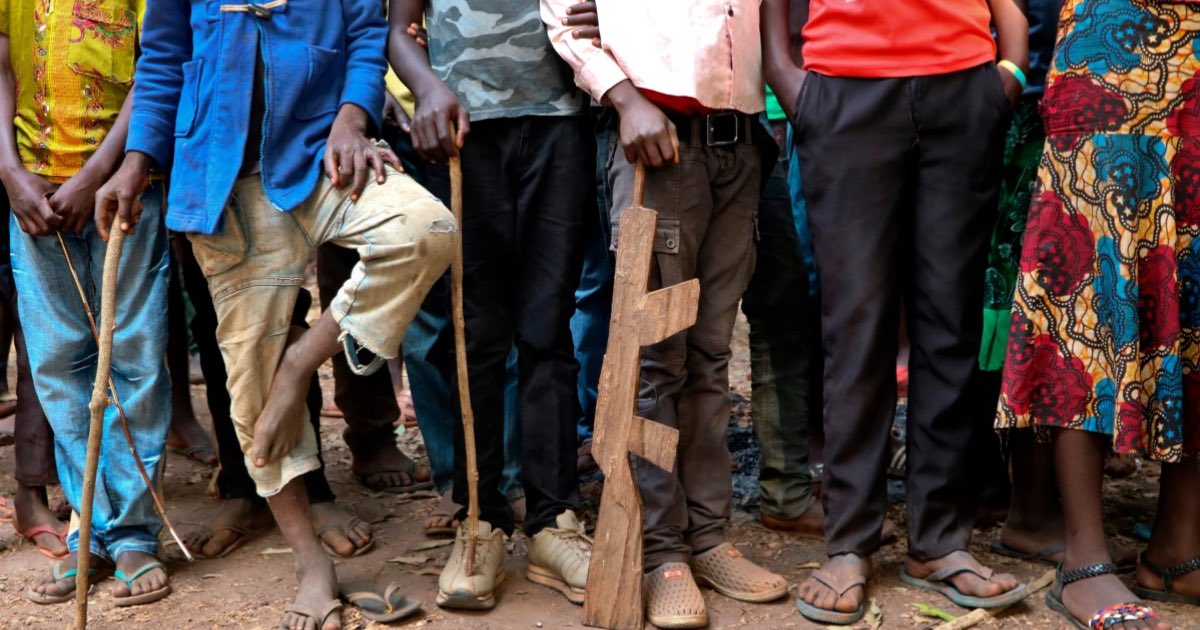 In this Feb. 2018 file photo, former child soldiers stand in line waiting to be registered with UNICEF to receive a release package, in Yambio, South Sudan. (AP Photo/Sam Mednick, File)